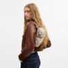 Ashton-Schultertasche mit Zeitungsdruck