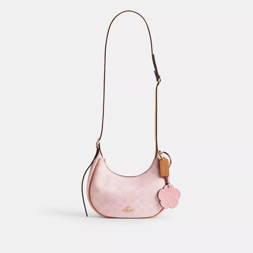 Emily-Schultertasche aus Signature Canvas mit Anhängern