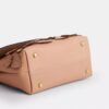 Emory-Handtasche mit Tragegriff und Blumenapplikation