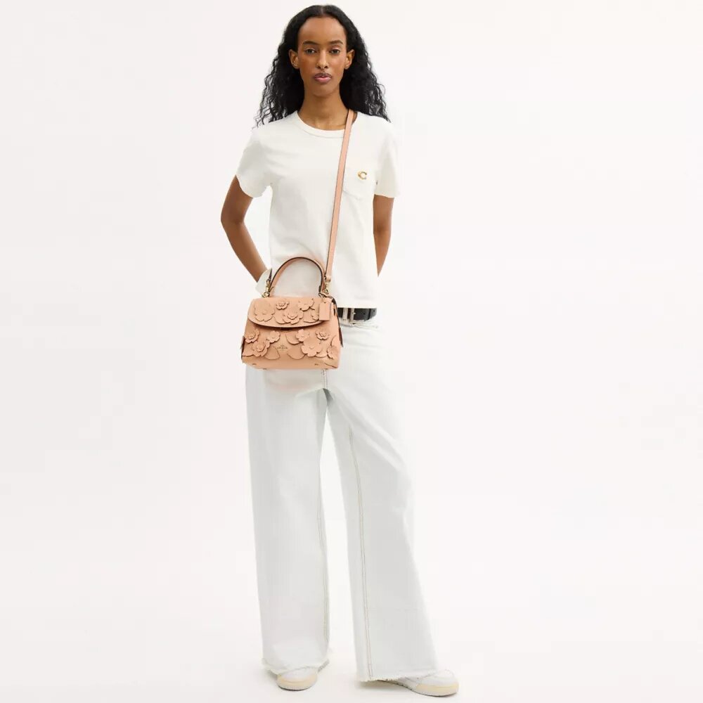 Emory-Handtasche mit Tragegriff und Blumenapplikation