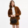 Emory-Handtasche mit Tragegriff und Blumenapplikation