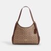 Erin-Schultertasche aus Signature Canvas