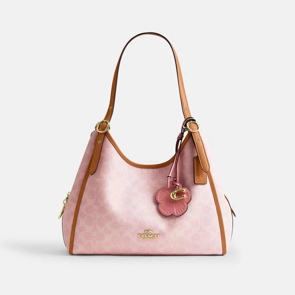 Erin-Schultertasche aus Signature Canvas mit Anhängern