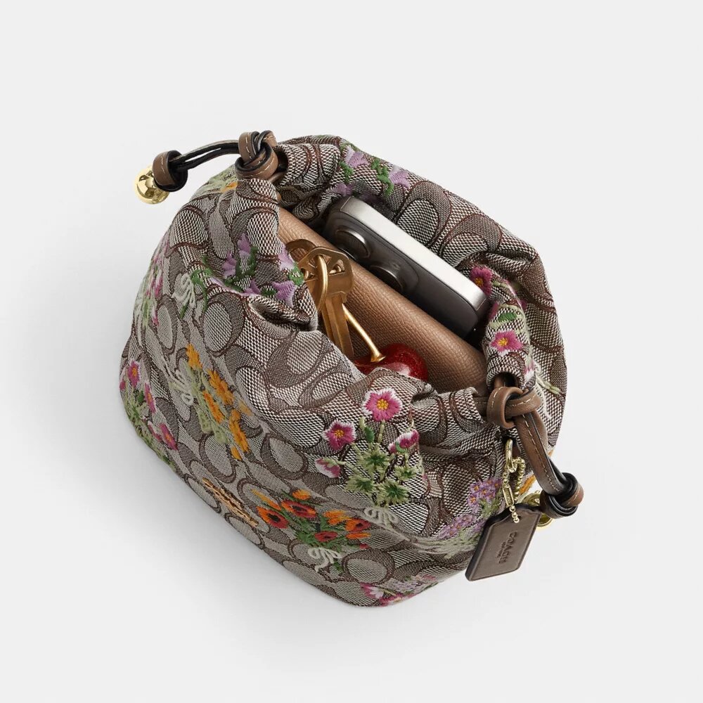 Faye Mini-Kordelzugtasche aus charakteristischem Jacquard mit Blumenstickerei