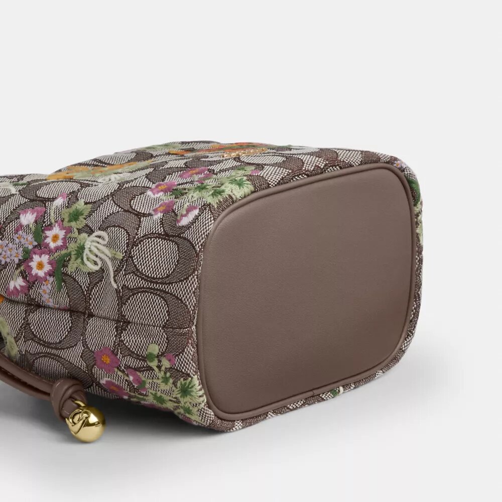 Faye Mini-Kordelzugtasche aus charakteristischem Jacquard mit Blumenstickerei
