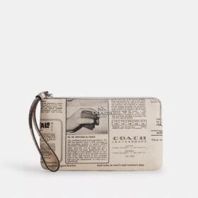 Große Handgelenktasche mit Reißverschluss an der Ecke und Zeitungsdruck