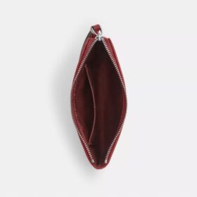 Handgelenktasche mit Reißverschluss an der Ecke aus charakteristischem Denim
