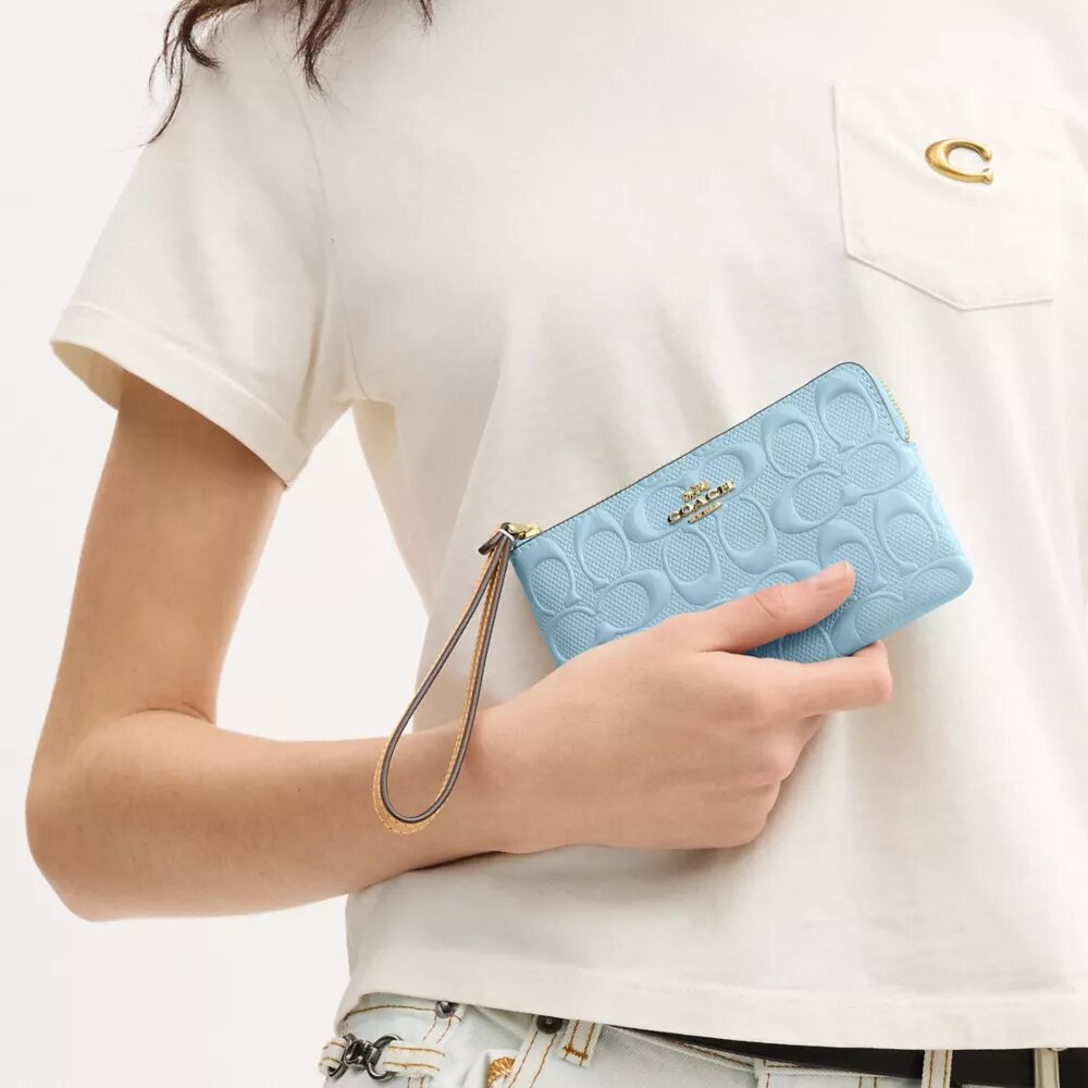 Handgelenktasche mit Reißverschluss an der Ecke aus Signature-Leder