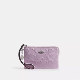 Handgelenktasche mit Reißverschluss an der Ecke aus Signature-Leder mit Herz-Anhänger