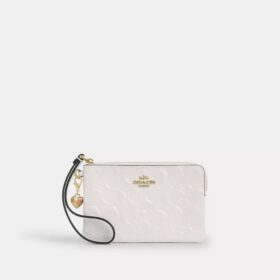 Handgelenktasche mit Reißverschluss an der Ecke aus Signature-Leder mit Herz-Anhänger