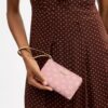 Handgelenktasche mit Reißverschluss an der Ecke und Blumenmuster