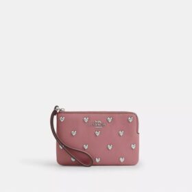 Handgelenktasche mit Reißverschluss an der Ecke und Herz-Nieten