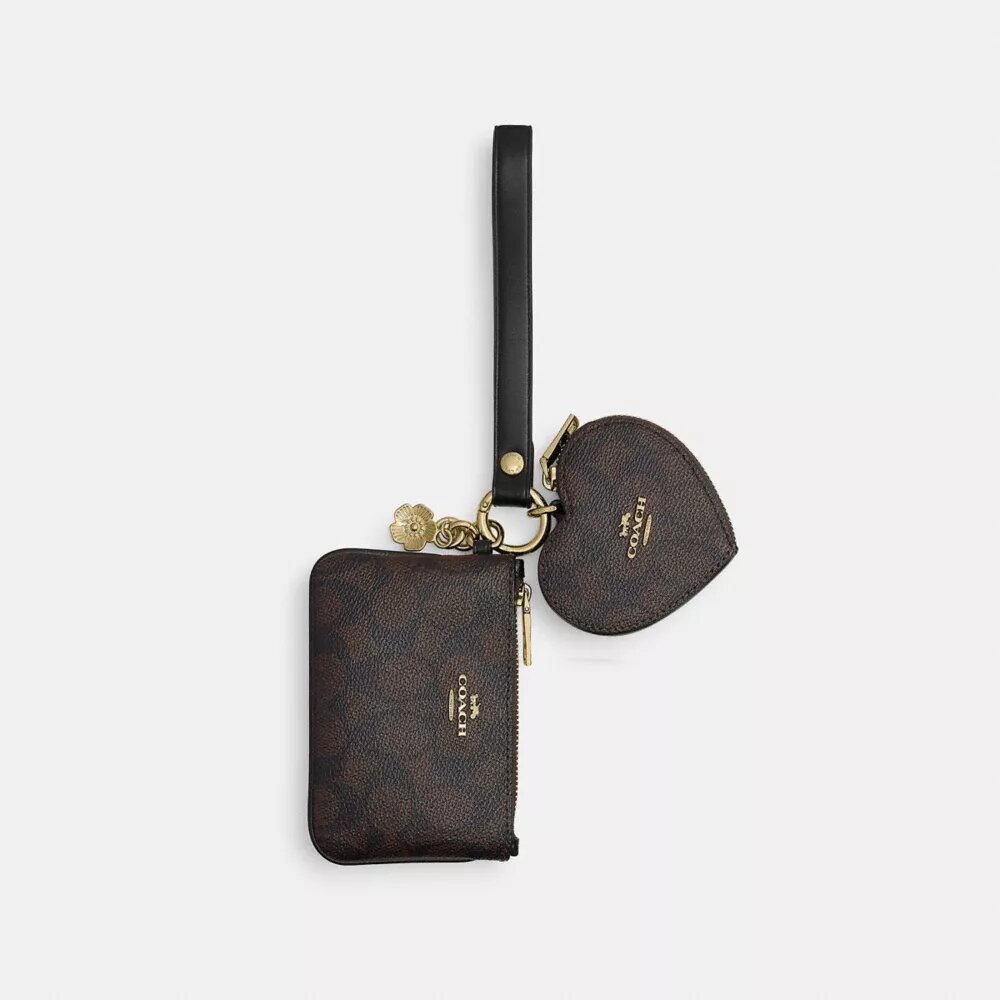 Handgelenktasche und Herztäschchen aus Signature Canvas mit Anhänger