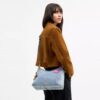 Laurel-Schultertasche aus Loved Denim mit Anhängern