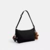Leo Crossbody aus Signature-Nylon mit Anhängern