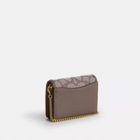 Mini-Geldbörse an einer Kette aus charakteristischem Jacquard mit Blumenstickerei