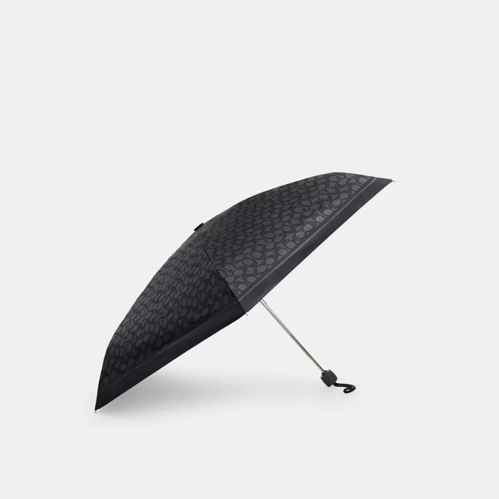 Mini-Regenschirm mit UV-Schutz im charakteristischen Print