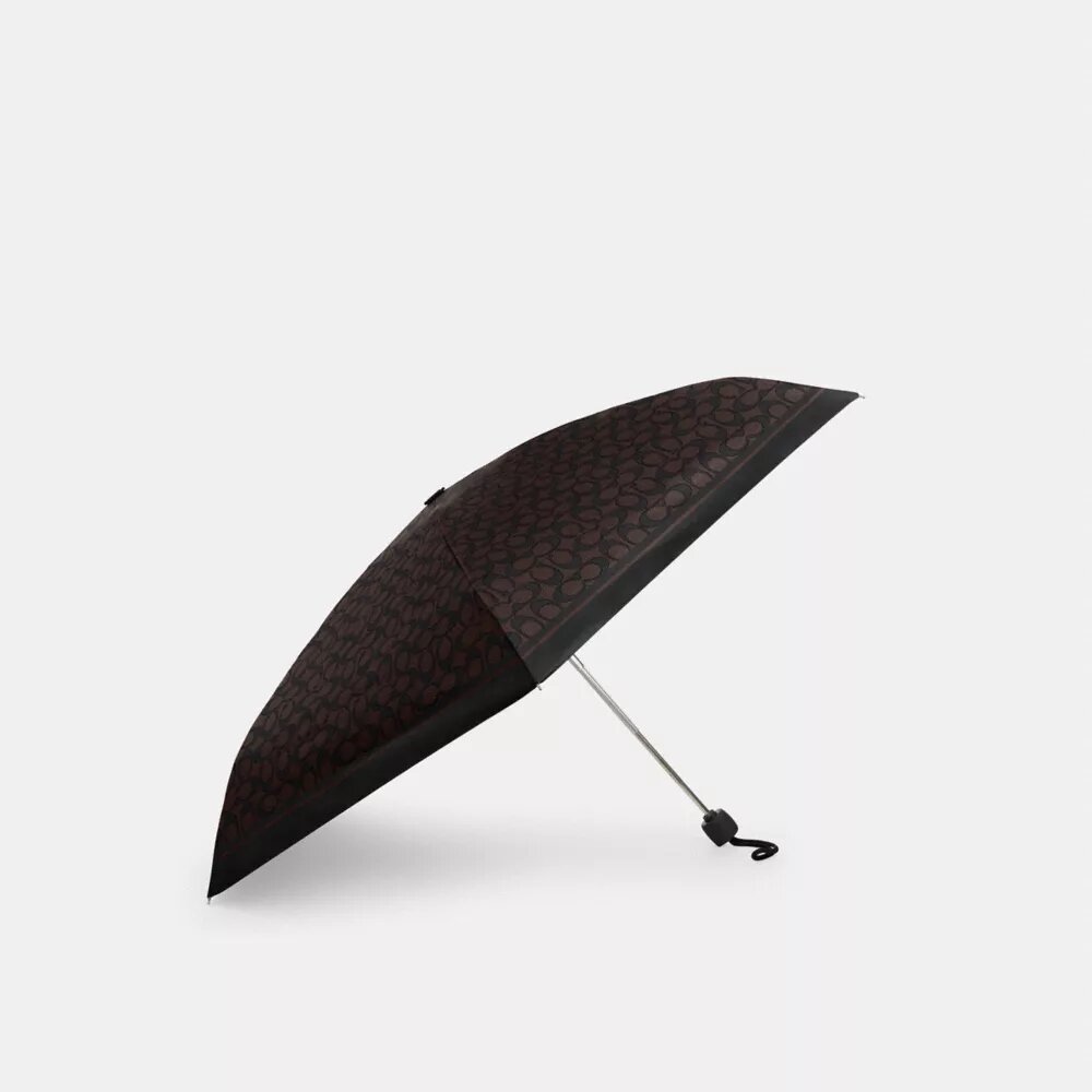 Mini-Regenschirm mit UV-Schutz im charakteristischen Print