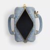 Mini-Rowan-Umhängetasche aus „Loved Denim“ mit Anhängern