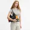 Rexy 10. Geburtstag Brooklyn-Schultertasche 28 mit Anhängern
