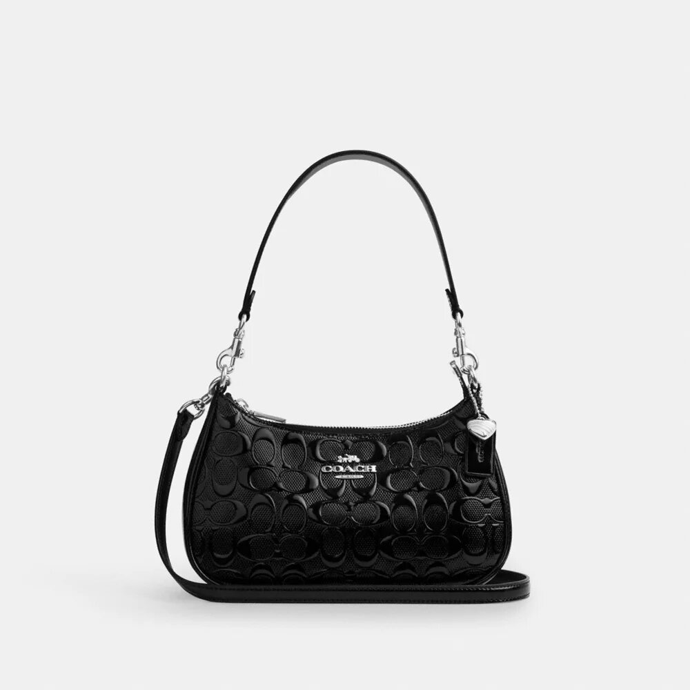Teri-Schultertasche aus Signature-Leder mit Herz-Anhänger