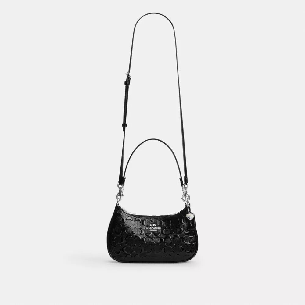 Teri-Schultertasche aus Signature-Leder mit Herz-Anhänger