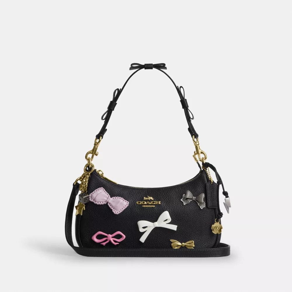 Teri-Schultertasche mit Schleifen und Anhängern