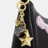 Teri-Schultertasche mit Schleifen und Anhängern