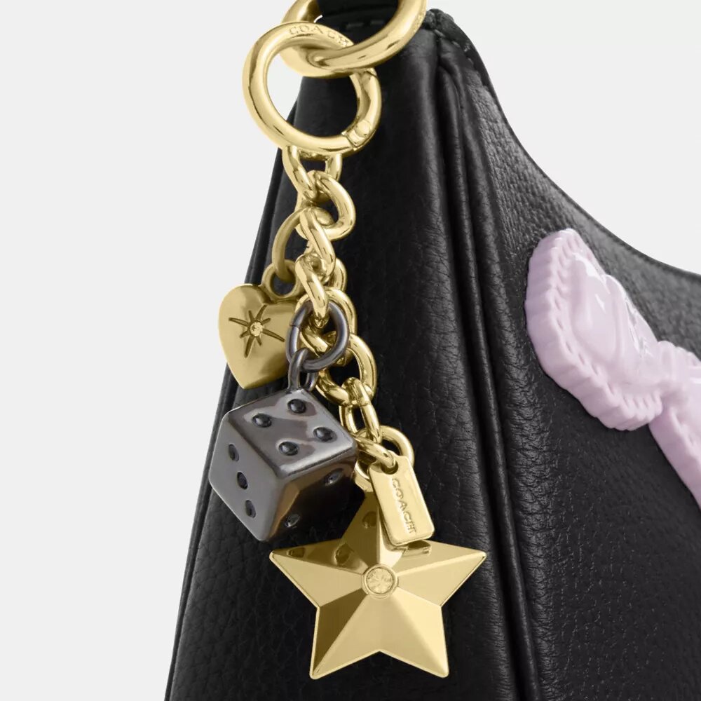 Teri-Schultertasche mit Schleifen und Anhängern