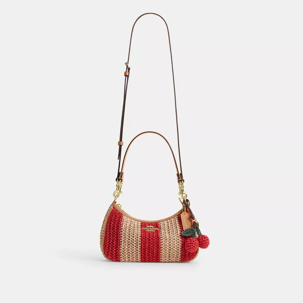Teri-Schultertasche mit Streifen und Anhänger