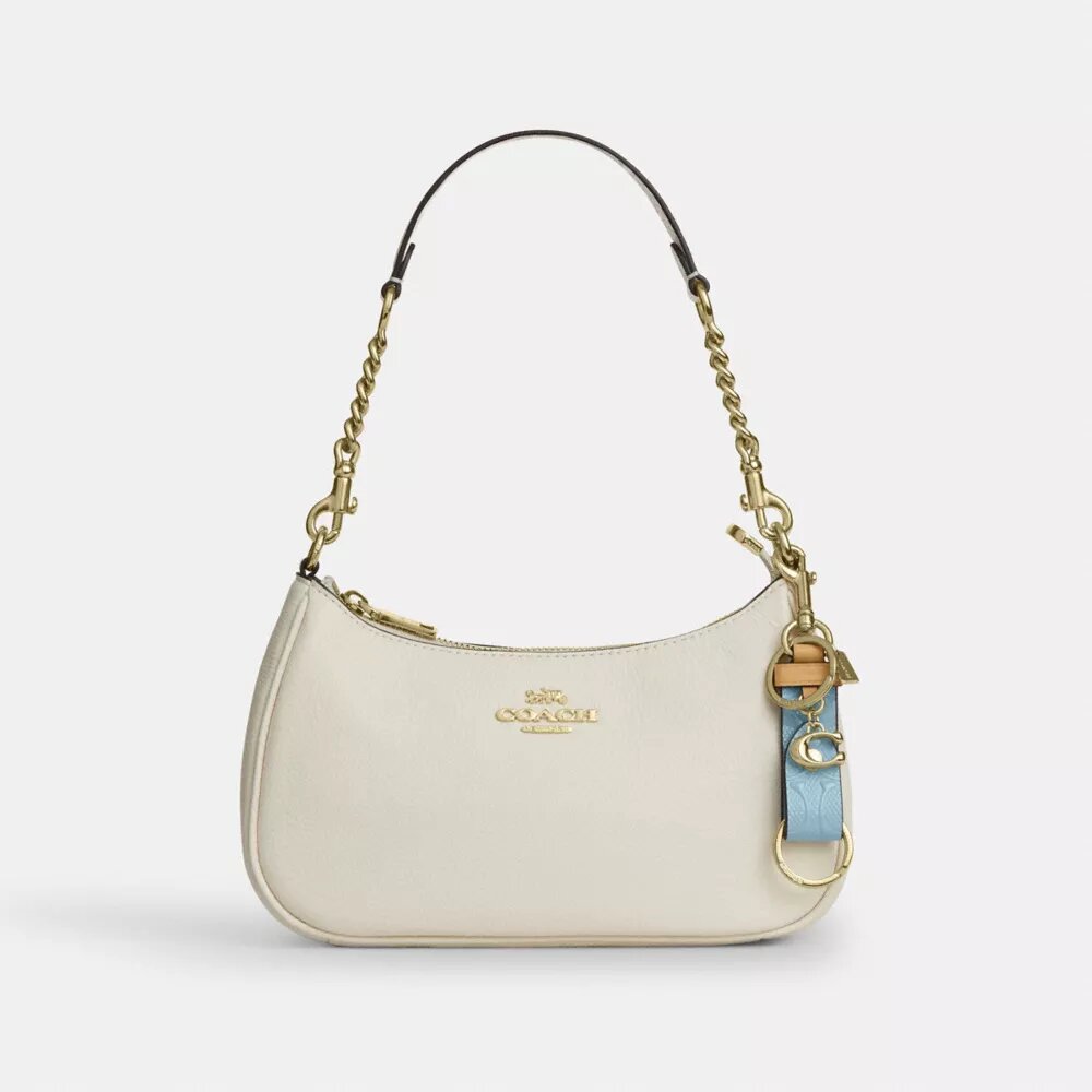 Trigger-Snap-Taschenanhänger aus Signature-Leder mit Anhänger