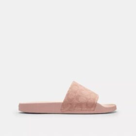 Udele Sport-Pantoletten aus unserem charakteristischen Signature Canvas