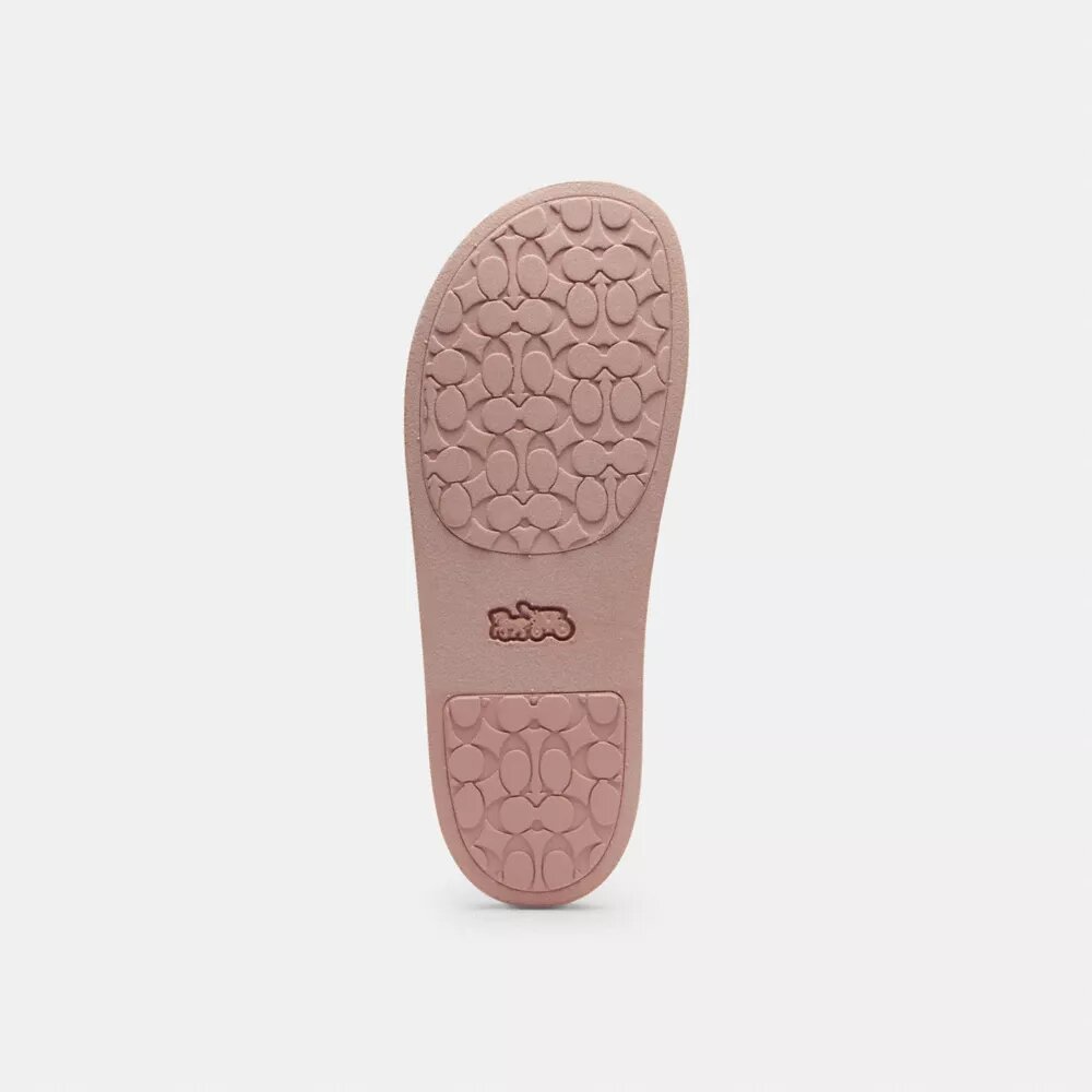 Udele Sport-Pantoletten aus unserem charakteristischen Signature Canvas