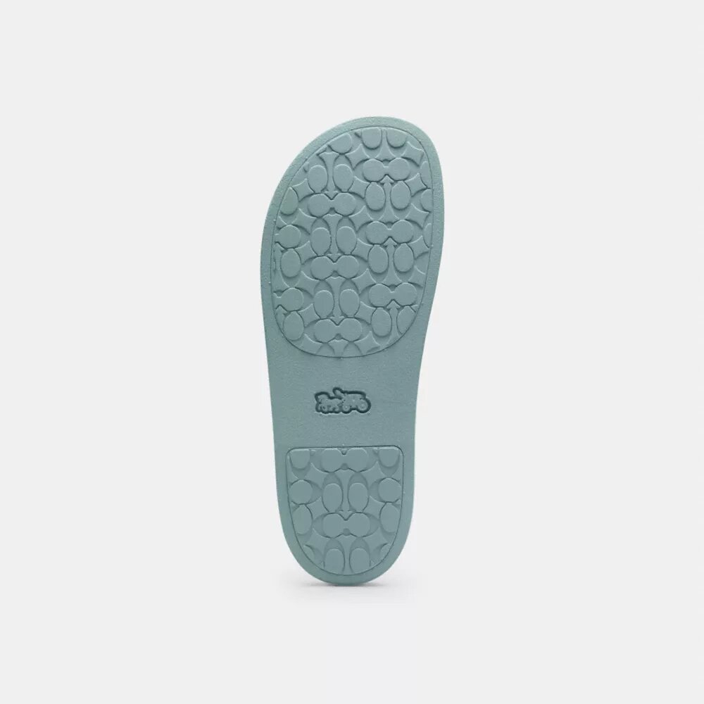 Udele Sport-Pantoletten aus unserem charakteristischen Signature Canvas