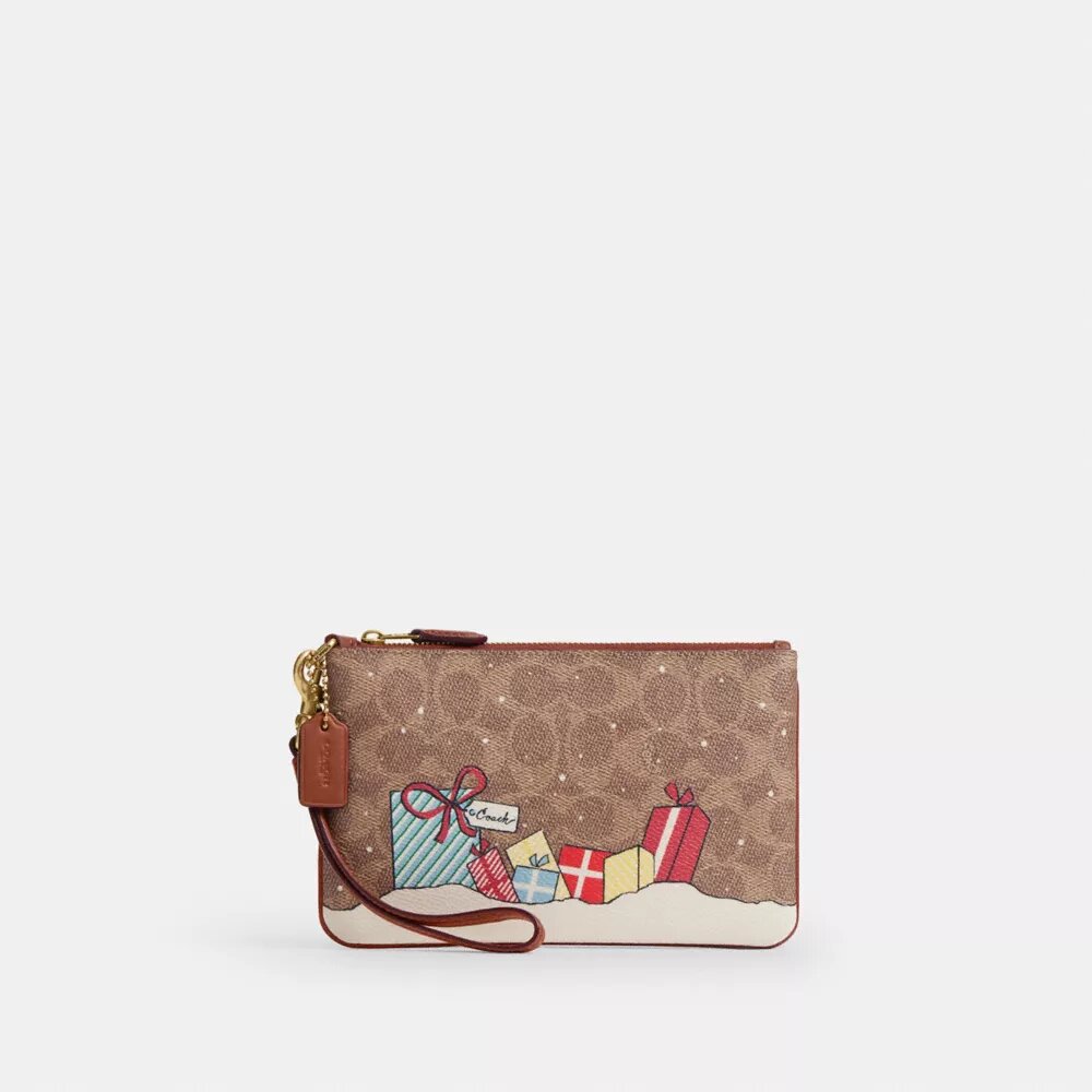 Unverzichtbare kleine Handgelenktasche aus Signature Canvas mit Weihnachtsgeschenken
