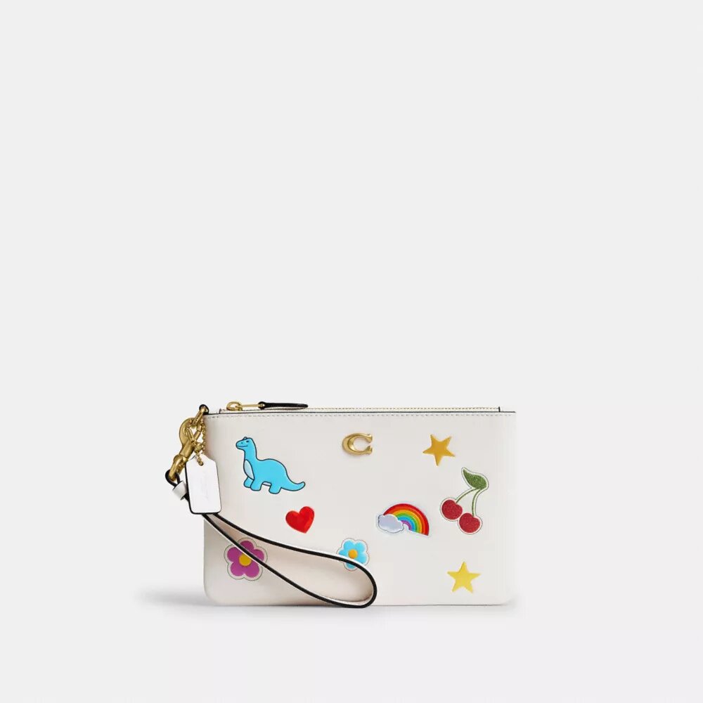 Unverzichtbare kleine Handgelenktasche mit Aufkleber-Print